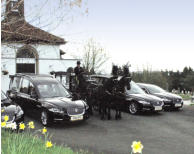 Jaguar hearse and limousine and horse drawn hearse